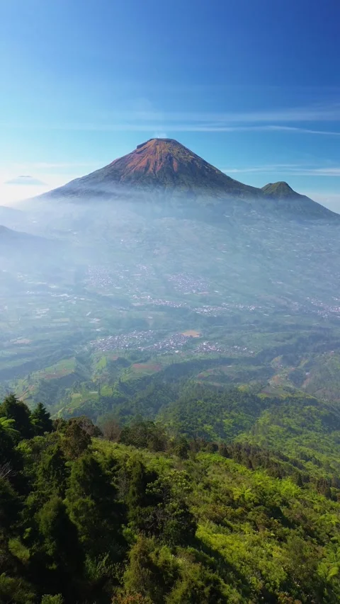 This portrait-format drone footage of the mountain was captured on a clear day. Stock Footage 343090457