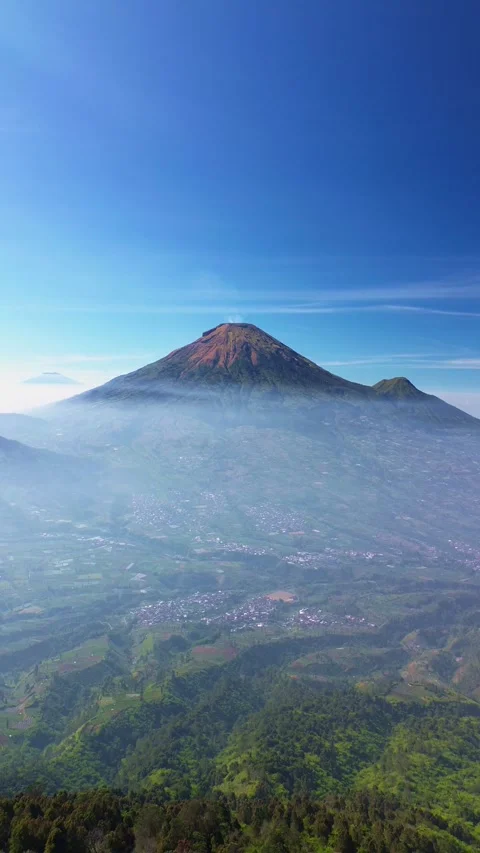 This portrait-format drone footage of the mountain was captured on a clear day. Stock Footage 343090488