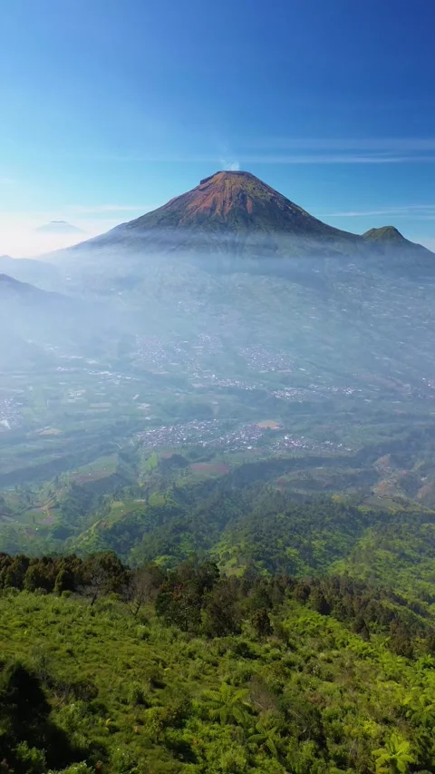 This portrait-format drone footage of the mountain was captured on a clear day. Stock Footage 343090491