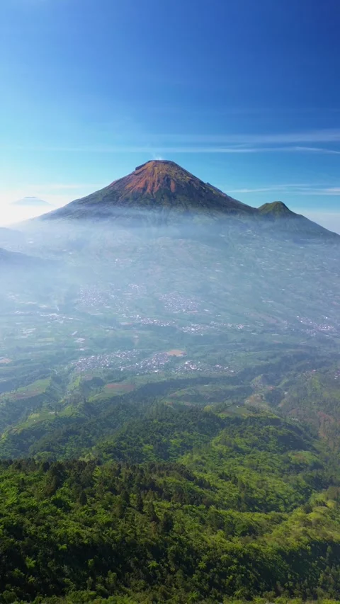 This portrait-format drone footage of the mountain was captured on a clear day. Stock Footage 343090780
