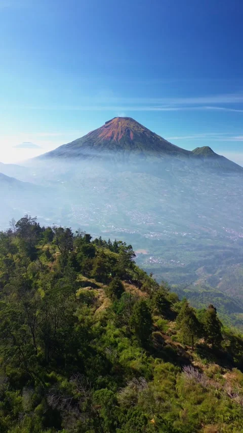 This portrait-format drone footage of the mountain was captured on a clear day. Stock Footage 343090782