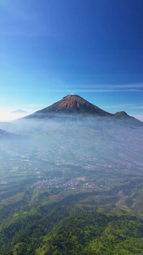 This portrait-format drone footage of the mountain was captured on a clear day. Stock Footage 343090800
