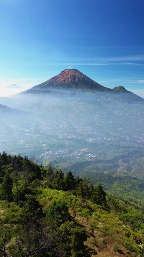 This portrait-format drone footage of the mountain was captured on a clear day. Stock Footage 343090832