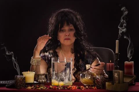 Portrait of fortune teller doing egg divination Foto stock