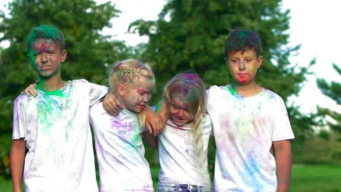 Portrait of four friendly kids: two boys and two blond girls standing in front Видео 70878377