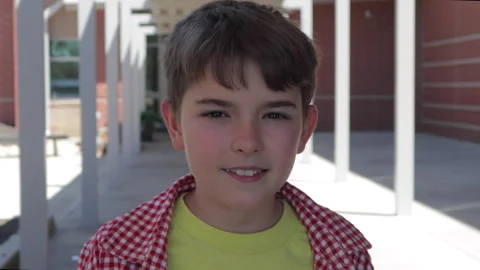 Portrait Friendly Boy Standing Outside Elementary School Building. School B.. Stock Footage 342621299