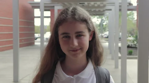 Portrait Friendly Girl With Backpack Standing Outside School Building. Scho.. 스톡 동영상 332814754