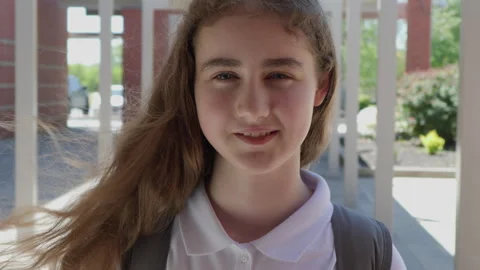 Portrait Friendly Girl With Backpack Standing Outside School Building. Scho.. Video stock 333597679