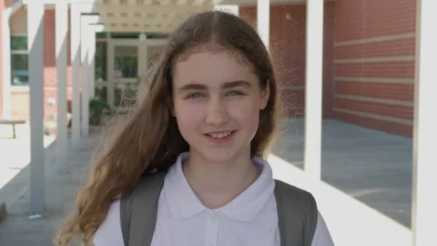 Portrait Friendly Girl With Backpack Standing Outside School Building. Scho.. 스톡 동영상 342623018
