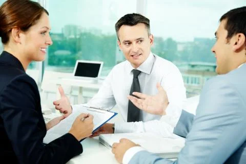 Portrait of friendly professionals planning work in office Stock Photos