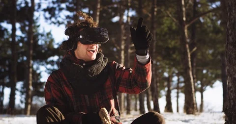 Portrait in front of the camera charismatic man with curly hair on the sleigh in Stock Footage 111965831