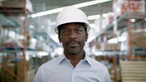 Portrait of a frontline essential worker in a warehouse. Stock Footage 134174207