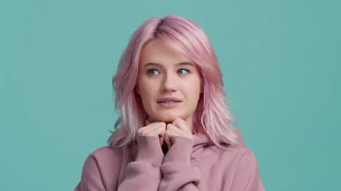 Portrait of fun scared young pretty hipster student 20s with pastel pink hair 스톡 동영상 223225549