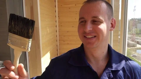 Portrait funny Engineer Worker Man Holding brush Showing Thumb Up Sign Looking Video stock 75210633