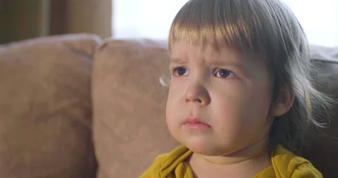 Portrait of funny kid 2-3 years old emotionally watching TV show series cartoons Stock Footage 150383003