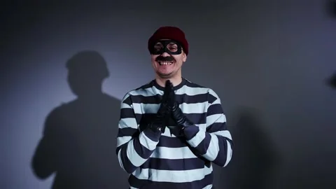 Portrait of a funny robber looking at the camera Stock-Footage 223834595