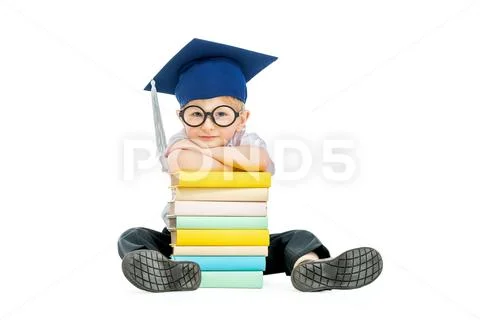 A portrait of a funny young schoolboy with books. Goods for pupils, education Stock Photos
