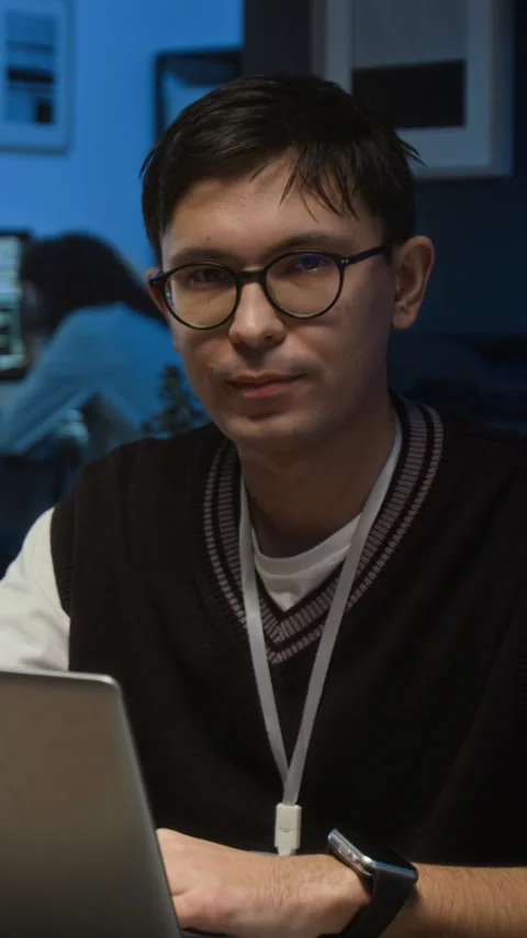 Portrait of Gen Z Web Designer Working on Project in Dimly Lit Office Setting Stock Footage 329617174