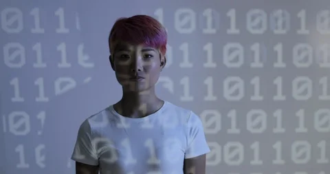 Portrait of gender fluid programmer in front of coding projection Stock Footage 104194049
