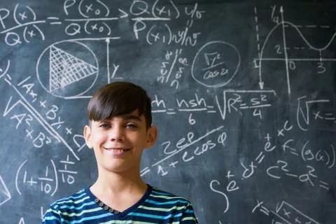 Portrait Genius Boy Smiling At Camera During Math Lesson Stock Photos