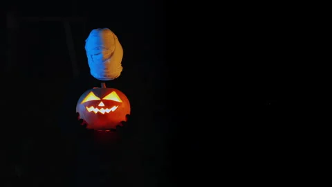Portrait of a ghost covered with white fabric ribbons in neon light. Stock Footage 286087279