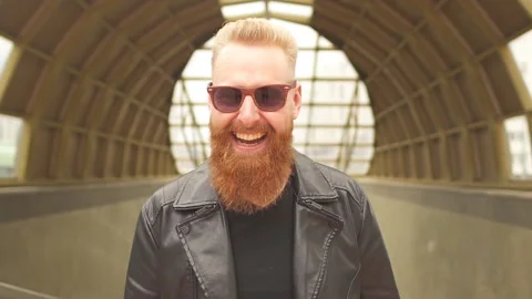 Portrait of ginger hipster man with beard smiling laughing looking at camera. Stock Footage 135602311