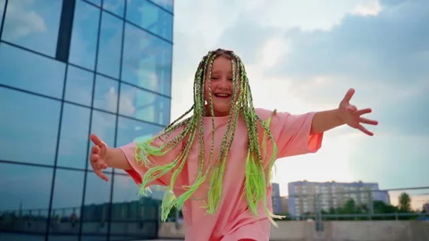 Portrait girl dancing looking at camera outdoors.  Slow motion 4k footage Stock Footage 202224513