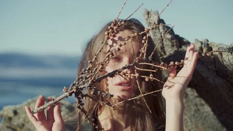 Portrait of a girl with elements of tree branches shot close-up Stock-Footage 141219331