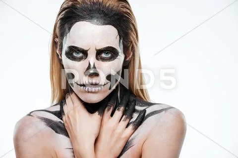 Portrait of girl with fearful skeleton makeup Stock Photos