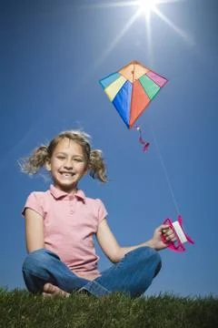 Portrait of a girl flying a kite Stock Photos