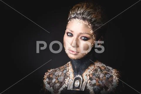 Portrait a girl with Golden icon painting makeup Stock Photos
