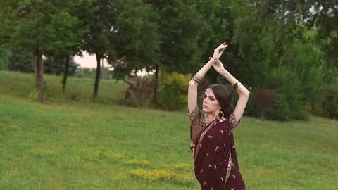 Portrait of a girl in Indian costume Sari in Park. Stock Footage