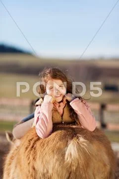 Portrait of a girl laying on her horse Stock Photos