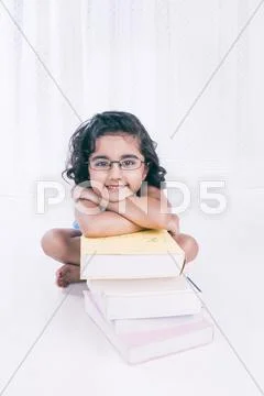 Portrait of a girl leaning on books Stock Photos