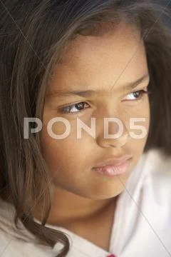 Portrait Of Girl Looking Thoughtful Stock-Fotos