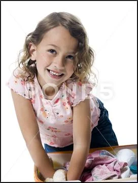 Portrait of a girl packing a suitcase Stock Photos