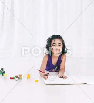 Portrait of a girl painting Stock Photos