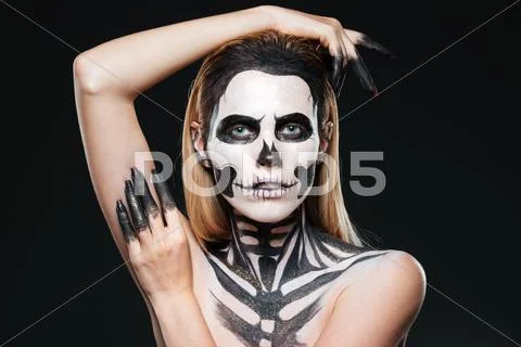 Portrait of girl with scared skeleton makeup Stock Photos