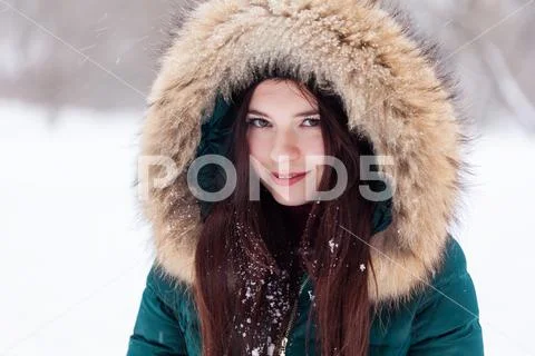 Portrait of a girl in a winter park Stock Photos