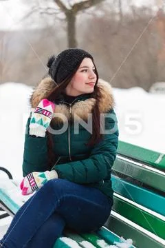Portrait of a girl in a winter park Stock Photos