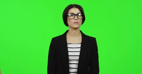 Portrait of the good looking brunette young woman in the glasses and black suit Video stock 89949643