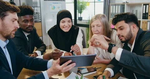 Portrait of good-looking positive confident skilled mixed race business mates Stock Footage 159614567