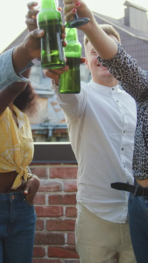 Portrait of good-looking positive satisfied multiethnic youth which celebrating  Stock Footage 327407703