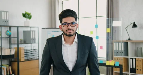 Portrait of good-looking smiling successful modern bearded businessman in Stock Footage 159719829