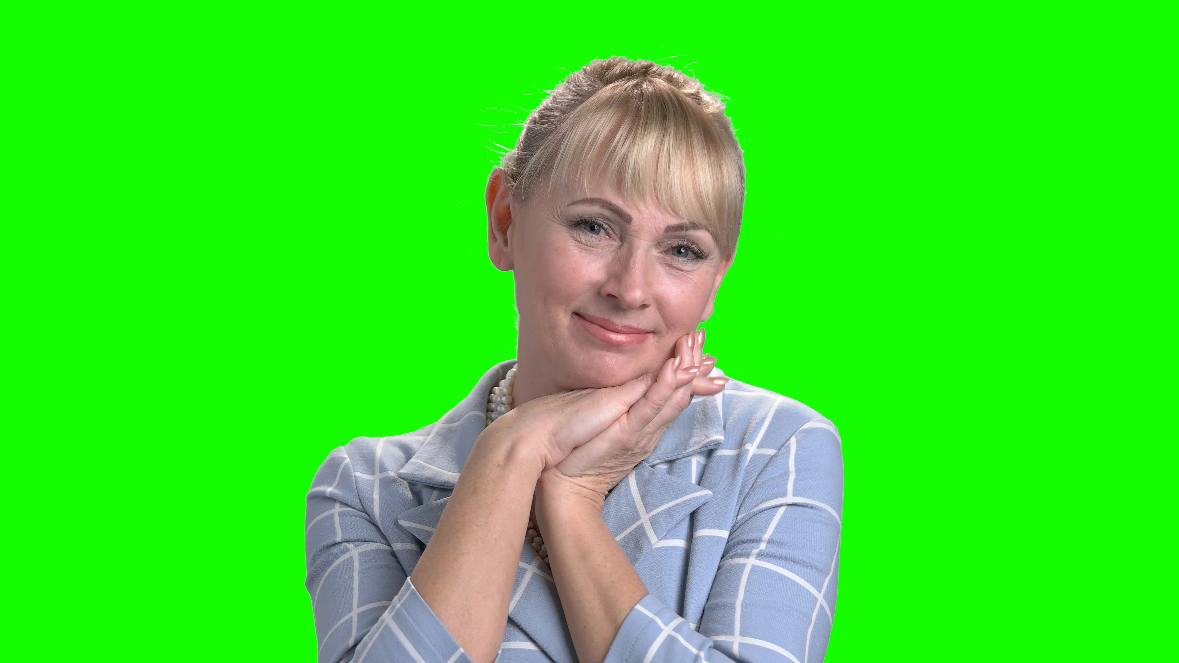 Portrait of gorgeous mature woman on green screen.