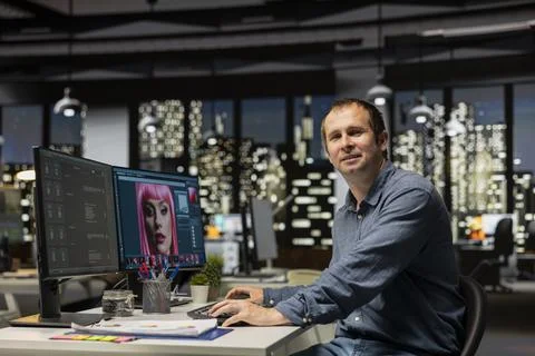 Portrait of graphic designer using AI powered content for image retouching Stock Photos