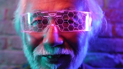 Portrait of gray haired elderly asian man, with futuristic glasses, smiling n Stock Footage 195814993