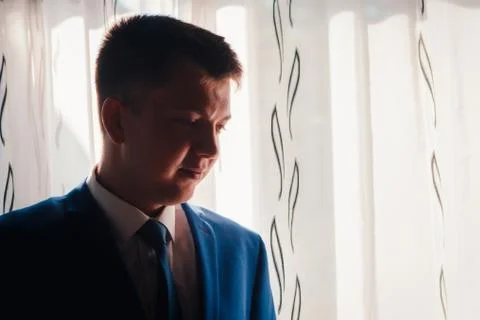 Portrait of the groom on a light background Stock Photos