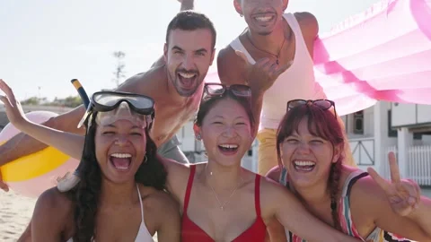 Portrait of group of multiracial people laughing looking at the camera in bikini Stock Footage 277083465