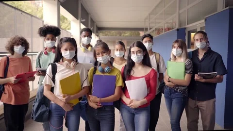 Portrait of a group of students in face mask looking at the camera. Back to Stock Footage 160629190